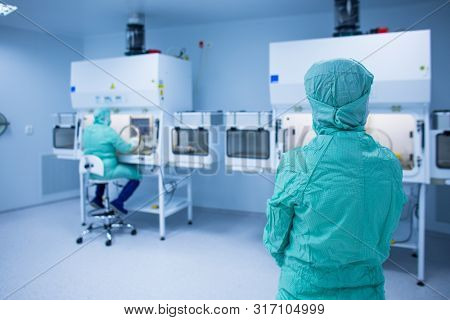 Cytostatic meds being prepared in a super clean lab environment - (shallow DOF; color toned image)