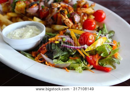 Breaded Shrimp With Vegetable Salad And Onion Dressing