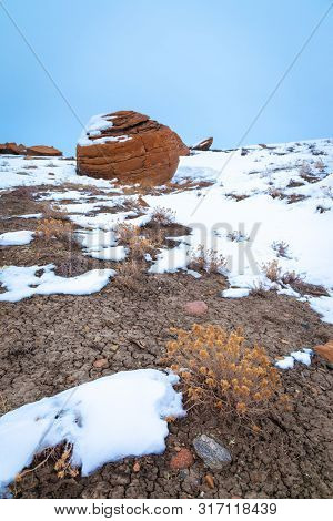 Large Red Boulders At Red Rock Coulee, Alberta, Canada In The Evening On A Cold Winter Day