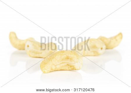 Group Of Five Whole Unsalted Beige Cashew Isolated On White Background