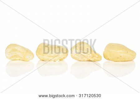 Group Of Four Whole Unsalted Beige Cashew Isolated On White Background