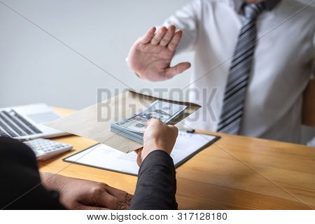 Anti Bribery And Corruption Concept, Business Man Refusing And Don't Receive Money Banknote In Envel