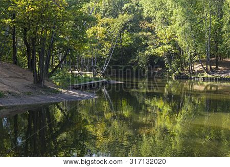 Pond In The Landscape Reserve Teply Stan, Moscow, Russia. Reflection Of Trees In The Water Surface.s