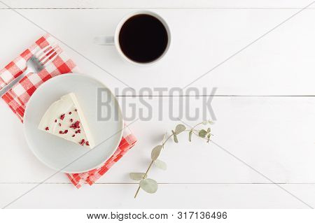 Piece Of Cheesecake On Gray Plate On Kitchen Spatula And Cup Of Coffee On Background