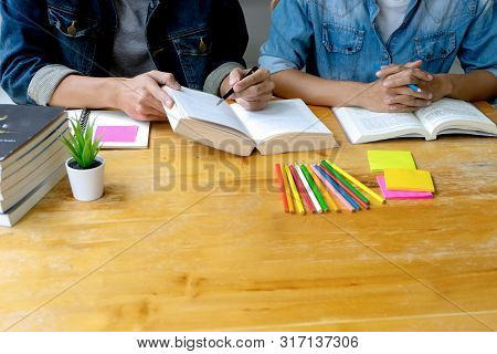 Woman And Man Work On The Table