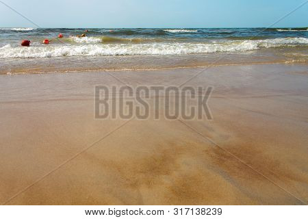 Sandy Beach Baltic Sea. Waves On The Sandy Beach.