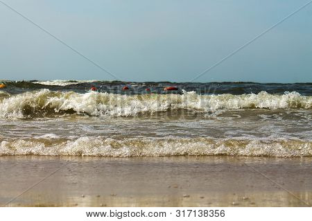 Sandy Beach Baltic Sea. Beach Sunset. Waves On The Sandy Beach.