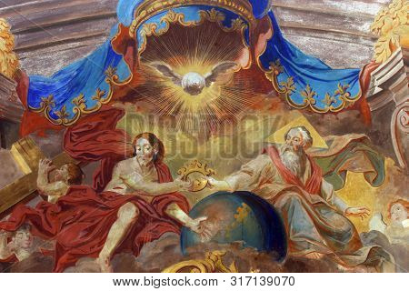 SAMOBOR, CROATIA - MARCH 03, 2018: Holy Trinity, altar fresco in the Church of the Assumption of the Virgin Mary in Samobor, Croatia