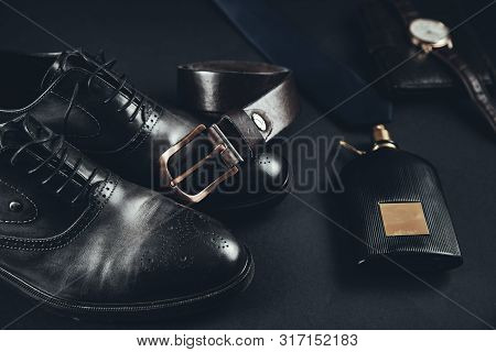 Man Different  Accessorise  On  The Dark  Table