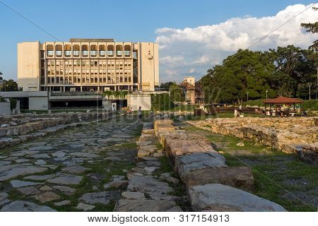 Stara Zagora, Bulgaria - August 5, 2018: Sunset View Of Regional Library And Ruins Of Ancient August