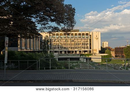 Stara Zagora, Bulgaria - August 5, 2018: Sunset View Of Regional Library And Ruins Of Ancient August