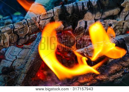 Smoldering Coals From The Fire. A Fading Bonfire. Close-up. Texture.