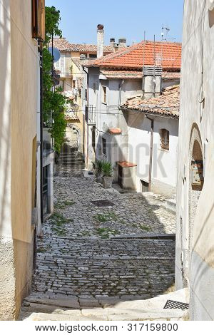 Narrow Street Between The Houses Of An Italian Medieval Village