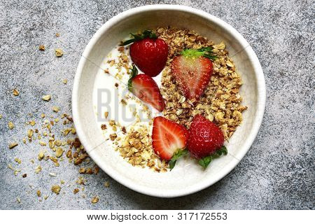 Homemade Multicereal Granola With Yogurt And Fresh Strawberry For A Breakfast.top View With Copy Spo