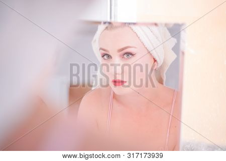 Attractive Young Woman Wrapped With Bath Towel After A Shower At The Bathroom.