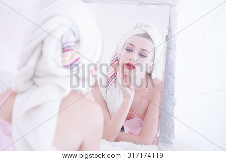 Attractive Young Woman Wrapped With Bath Towel After A Shower At The Bathroom.