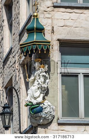 Antwerpen, Belgium - June 23, 2019: Closeup Of White Stone With Golden Crowns Statue Of Madonna With