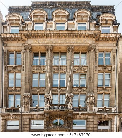 Antwerpen, Belgium - June 23, 2019: Upper Levels Of Beige-brown Facade Of Monumental Diamond Exchang