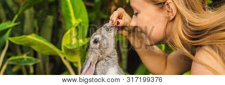 Woman Holding A Rabbit. Cosmetics Test On Rabbit Animal. Cruelty Free And Stop Animal Abuse Concept 