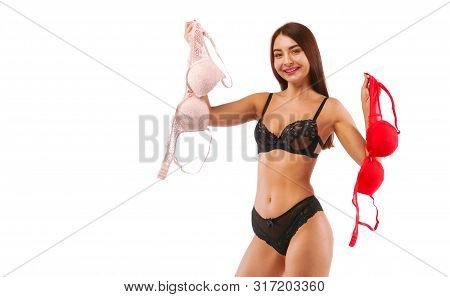 Red And Beige Bra In Brunette Woman Hands, Isolated On White.