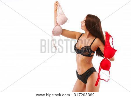 Red And Beige Bra In Brunette Woman Hands, Isolated On White.