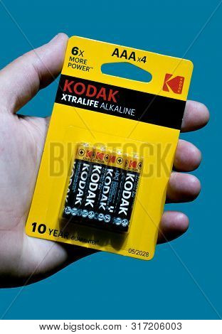 Bucuresti, Romania. August, 14, 2019- Battery Pack Held In Hand With A Blue Background. Kodak Batter