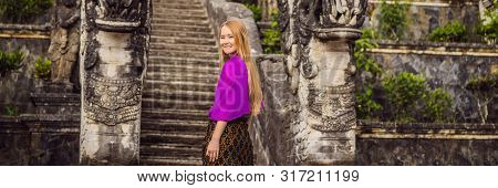 Banner, Long Format Young Woman Tourist On Background Of Three Stone Ladders In Beautiful Pura Lempu