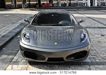 Kiev, Ukraine. June 9, 2013; Ferrari F430 In Gray On The Background Of Buildings