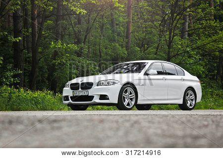Kiev, Ukraine. May 17, 2014. Bmw 520 Tdi (f10) M Sport In The Forest.