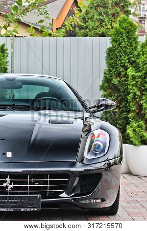 Ukraine, Kiev; September 2, 2013; Ferrari 599 Gtb Fiorano. Black Ferrari Stands In The Yard