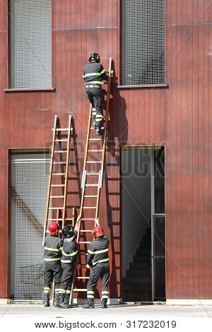Many Fireman At Fire Station During A Practice Training