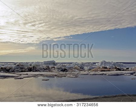 Melting Snow In The Spring. The Spring Heat Will Melt The Snow. Brooks And Streams Of Melt Water