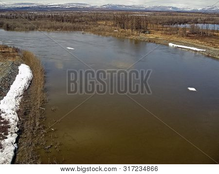 Melting Snow In The Spring. The Spring Heat Will Melt The Snow. Brooks And Streams Of Melt Water