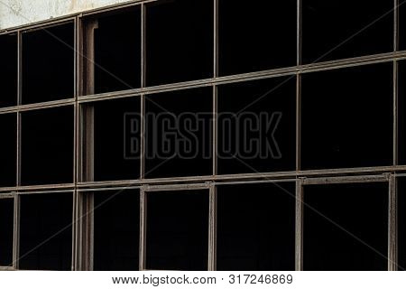 Unfilled Tape Glazing Of An Abandoned Industrial Building Close-up