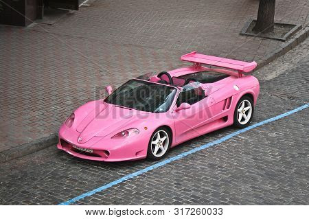 Kiev, Ukraine; May 17, 2016. Pink Ferrari Modena F360 Spider Sbarro Gt8