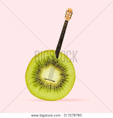 Juicy Sound Of Favourite Songs. Kiwi As A Body Of Acoustic Guitar On Coral Background. Negative Spac