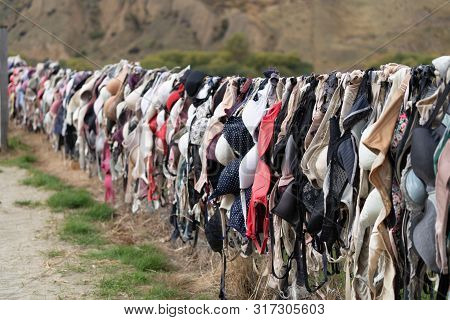 The Place Sign Of Famous Bras Fence Of Cardrona, Central Otago, New Zealand For Support New Zealand 