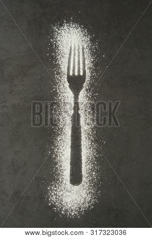 Imprint Fork Silhouette Made Of Flour On A Black Backgraund. Gluten Free Concept. Lose Weight, Dieti