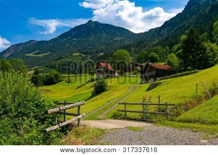 Typical Wood House And Barn In Swiss Village Lungern, Canton Of Obwalden, Switzerland
