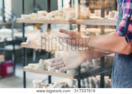 Middle Age Male Hands Clapping Hands With Powder.