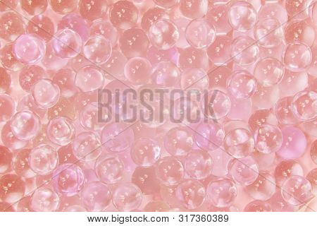 Abstract Texture Of Transparent Glass Balls With Pink Ink Or Lump Of Marbles. Collagen Hydrolysate. 