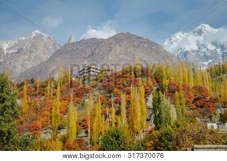 Nature Landscape View Of Colorful Foliage Forest Trees In Autumn Season And Snow Capped Ultar Sar Mo
