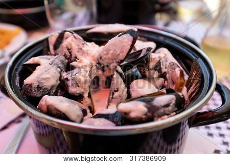 Closeup Of Traditional Dish Of French Cuisine, Appetizing  Mussels With Sauce In Pyla-sur-mer. Franc