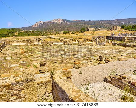 Tarifa, Spain - June 28, 2019. Remains Of The Forum With The Shops In The Foreground. Baelo Claudia 