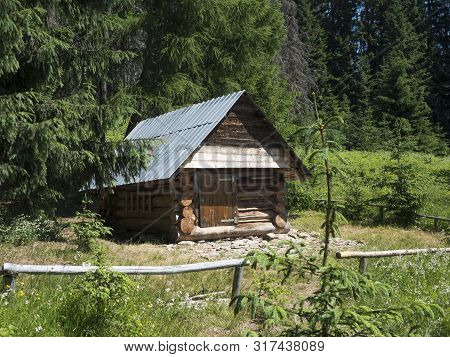 Slovakia, Western Tatra Mountain, July 3, 2019: Wooden Timbered House Cottage Koliba Horica At Begin
