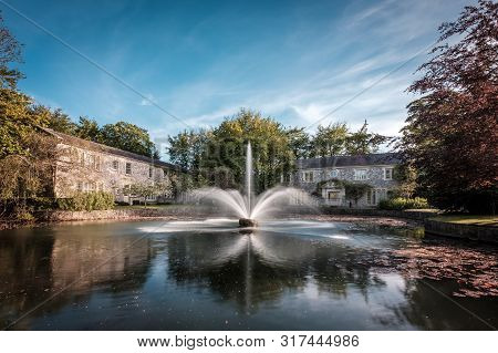 Cliff At Lyons, Celbridge, Kildare, Ireland - 13th May 2019. A Water Fountain Forms A Dramatic Centr