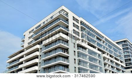 Contemporary Residential Building Exterior In The Daylight. Modern Apartment Buildings On A Sunny Da