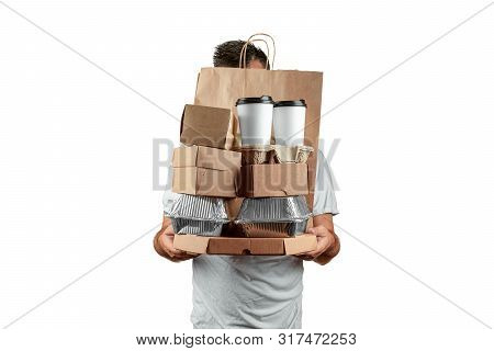Man In A Bright T-shirt Giving A Fast Food Order Isolated On A White Background. Male Courier Worker