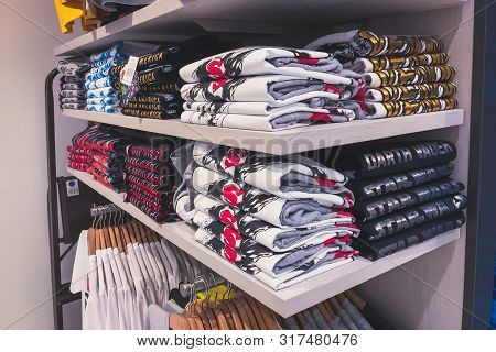 Men Clothes Are Stacked In Shelf