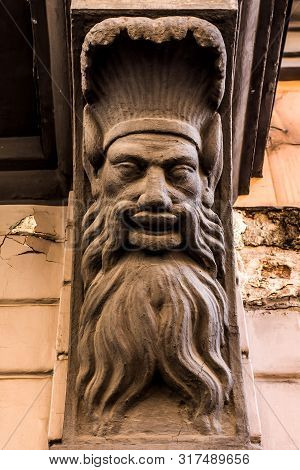 Mascaron In The Form Of Greenman On Building